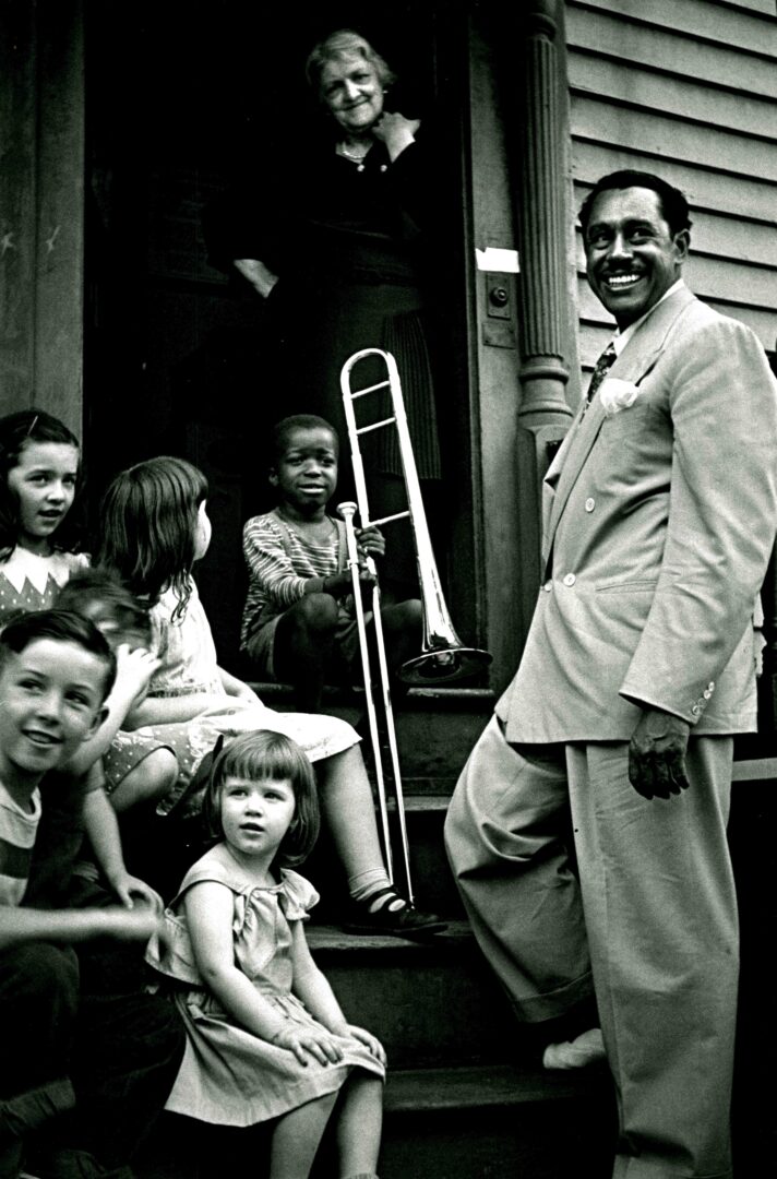 Milt Hinton Vicksburg, MS 1910–2000 New York City Cab Calloway with Children and Winner of Calloway Quizzical, Providence, RI, ca. 1938, 1938 Gelatin silver print Gift of Hank O'Neal and Shelley M. Sheir, 2023 2023.17 12 ½ in. x 8 ½ in. (f) currently unframed FF19 Condition: checked