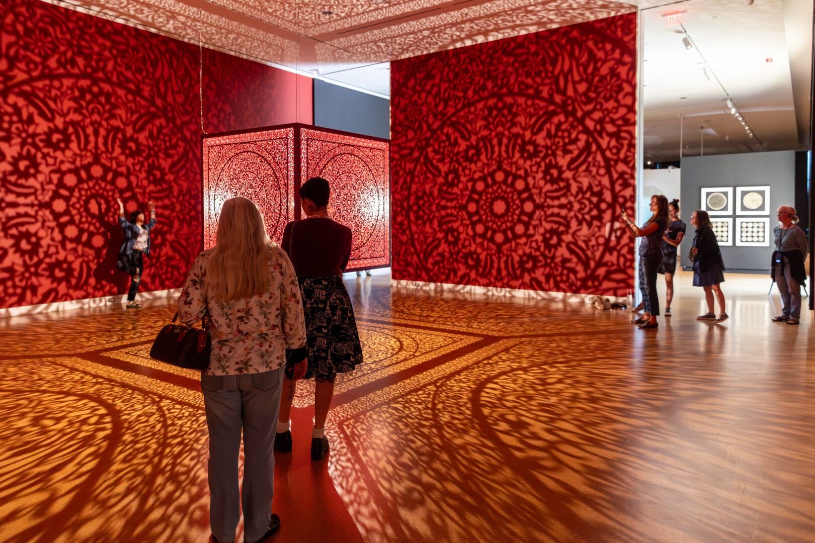 Museum Visitors Experiencing Interwoven Exhibition