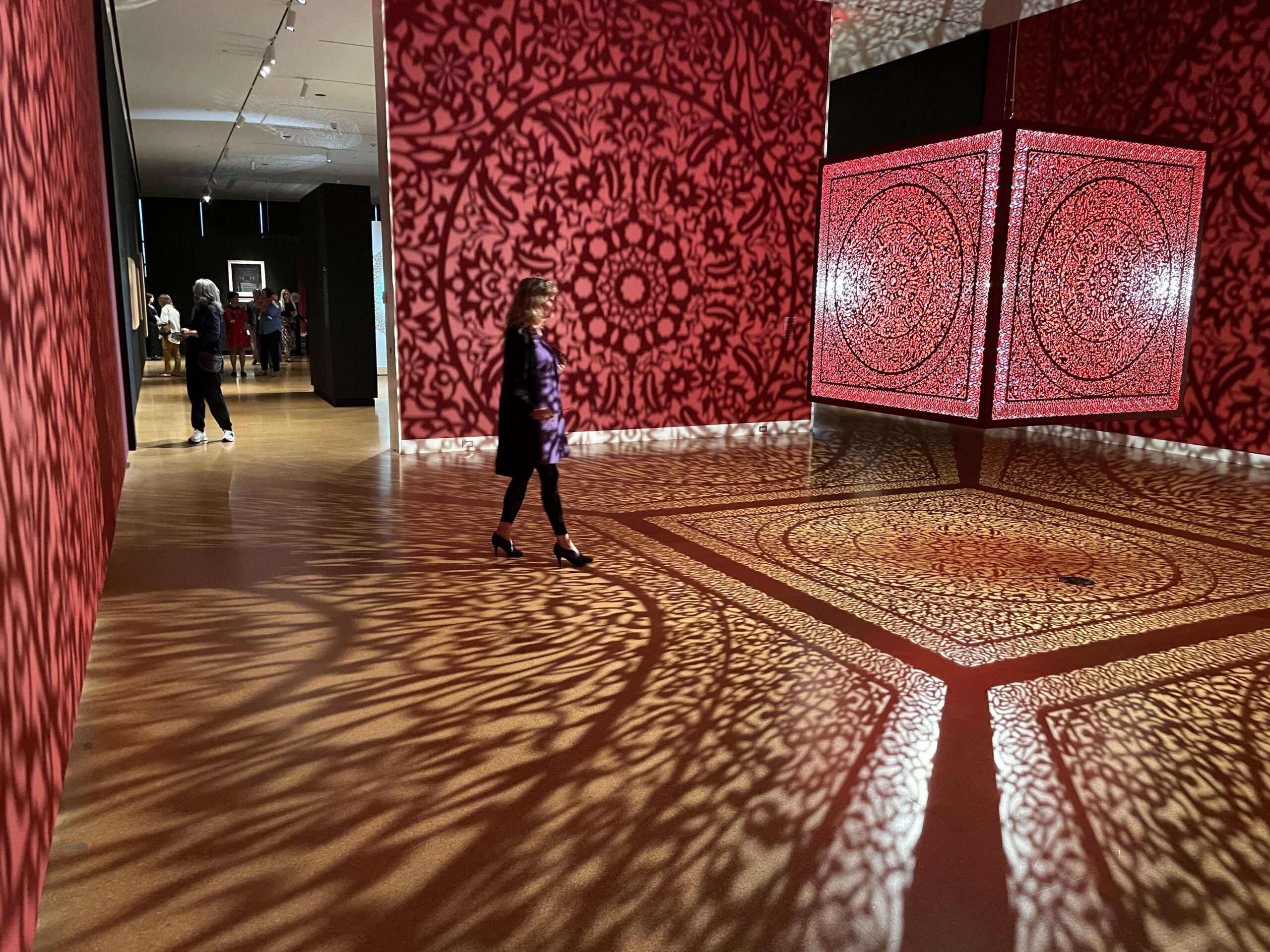 Anila Quayyum Agha, All the Flowers Are for Me (Red), 2016. Lasercut lacquered stainless steel and halogen bulb, Cincinnati Art Museum. Purchase, Alice Bimel Endowment for Asian Art © Anila Quayyum Agha