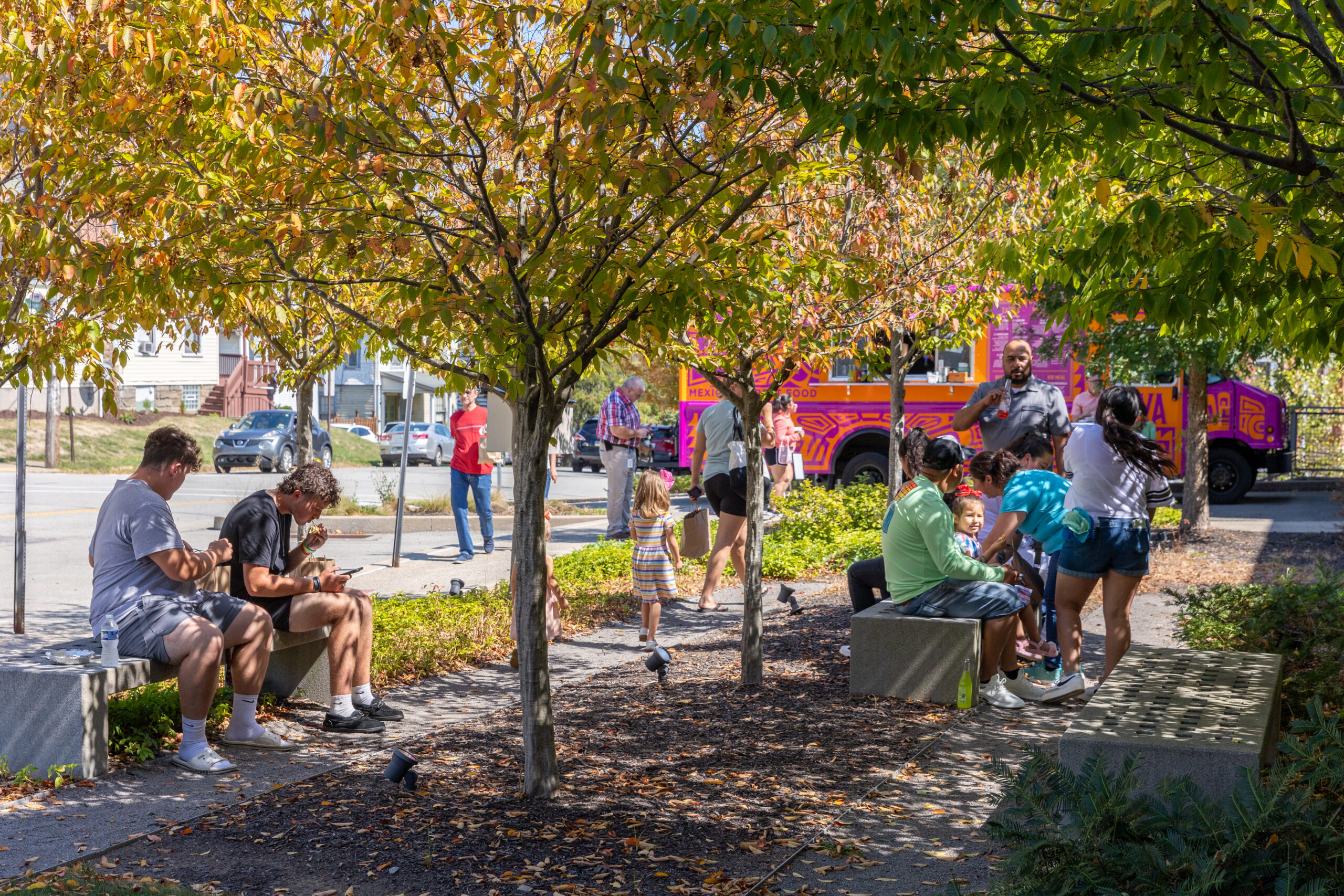 People outside of the Museum on north entrance side enjoying garden area